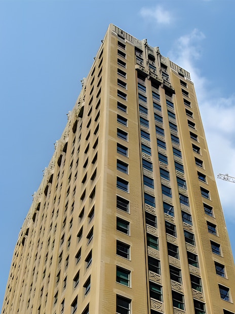 Virgin Hotel building exterior in downtown Chicago against a clear sky.