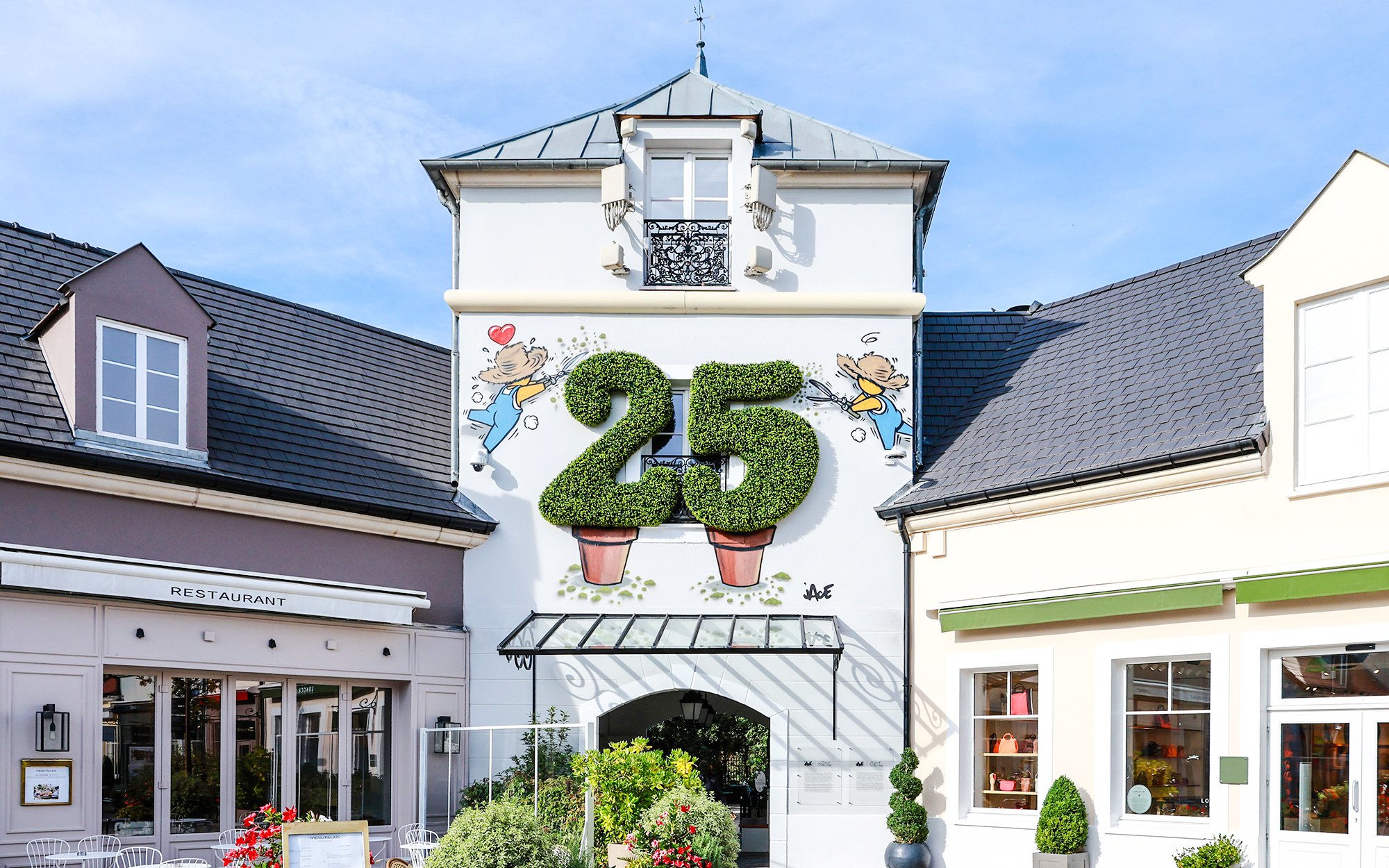 La Vallee Village entrance with topiary number 25, Paris, France.