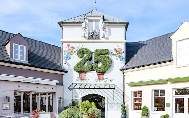 La Vallee Village entrance with topiary number 25, Paris, France.