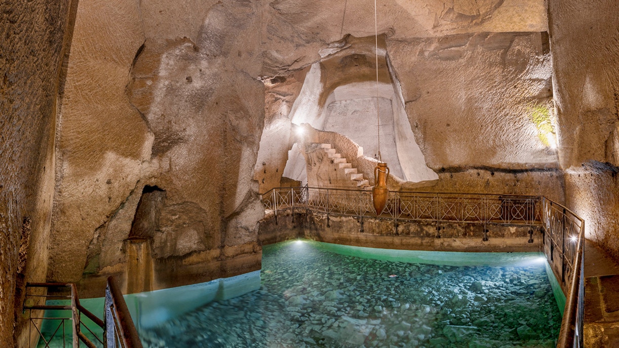 Bourbon Gallery in Naples underground ruins, featuring ancient Napoli sotterranea architecture.
