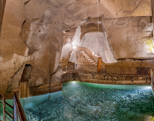 Bourbon Gallery in Naples underground ruins, featuring ancient Napoli sotterranea architecture.