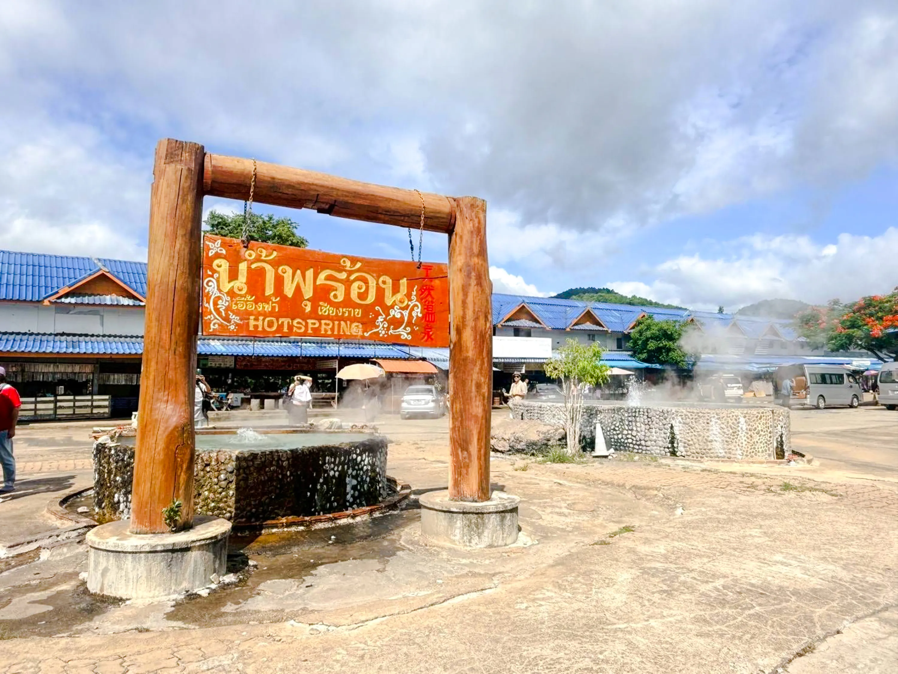 Hot spring with steam rising, Chiang Mai to Chiang Rai tour.