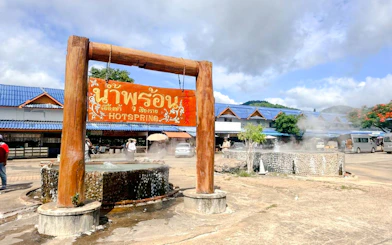 Hot spring with steam rising, Chiang Mai to Chiang Rai tour.