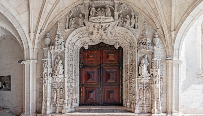 Jeronimos Monastery South Portal, Lisbon, showcasing intricate Manueline architectural details.