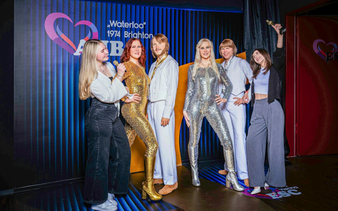 Wax figures of a famous pop group at Madame Tussauds Vienna.