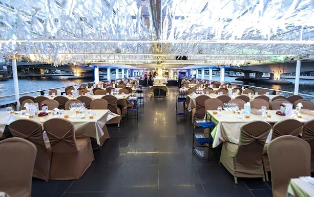 Dinner tables set on Chao Phraya Princess Cruise, Bangkok.