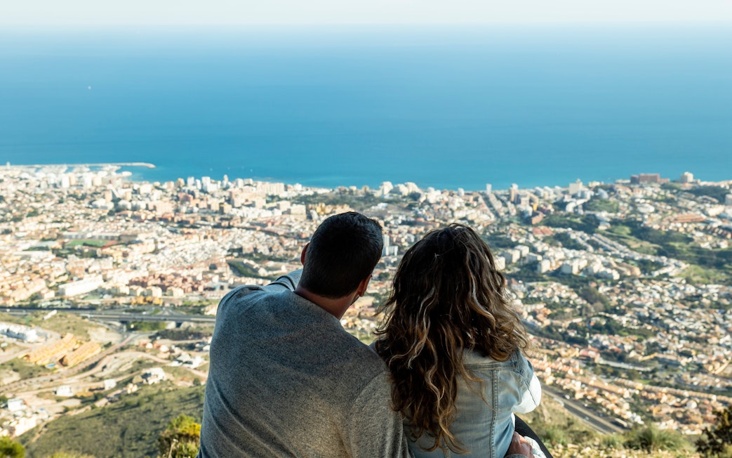 Couple enjoying panoramic view from Benalmadena cable car station, Malaga, Spain.