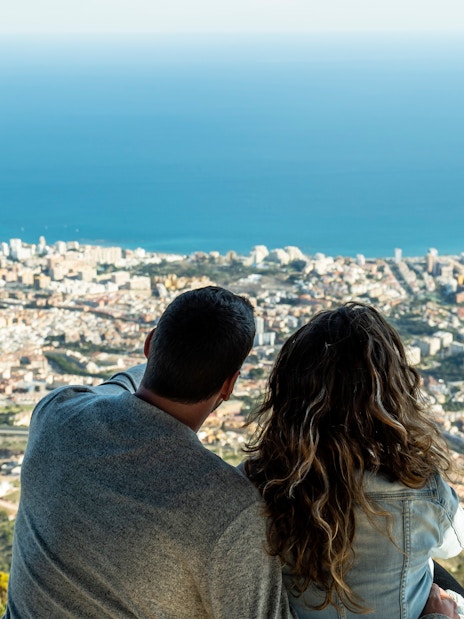 Couple enjoying panoramic view from Benalmadena cable car station, Malaga, Spain.