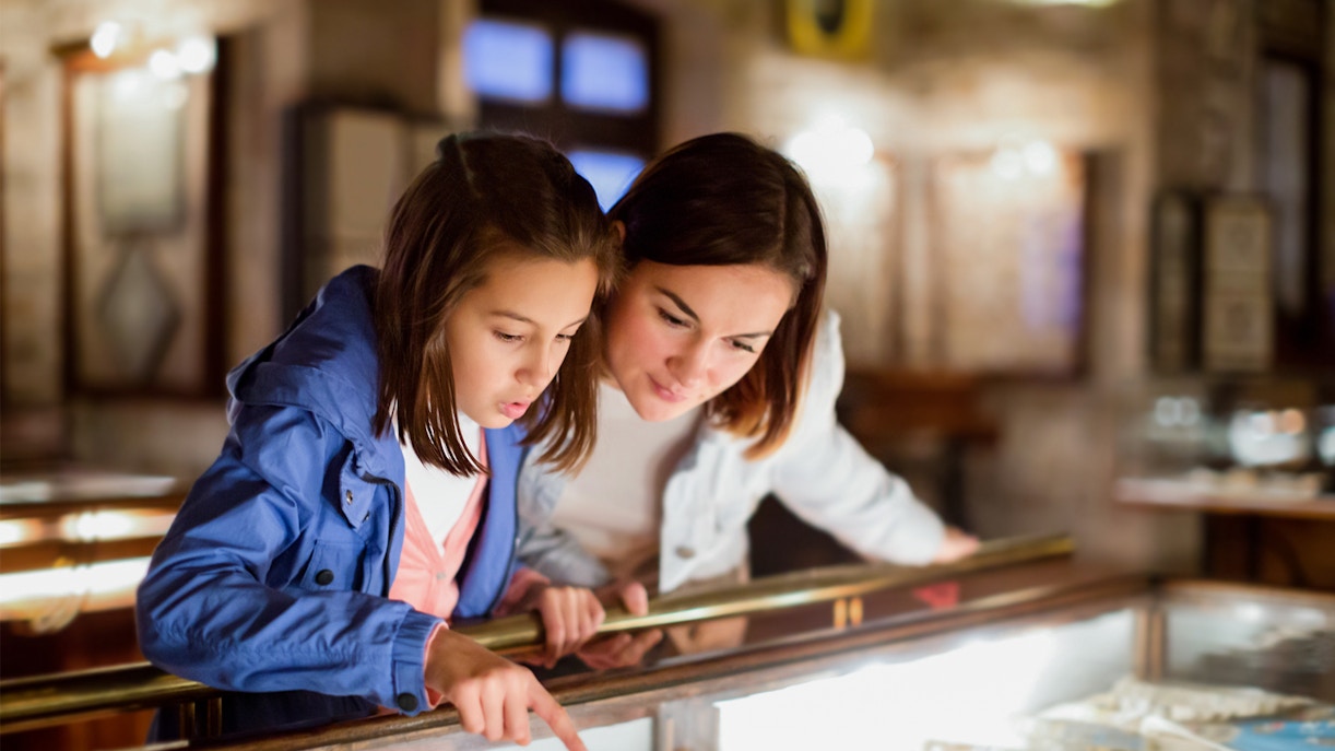 Mother and daughter examining exhibit at Sciencework museum.