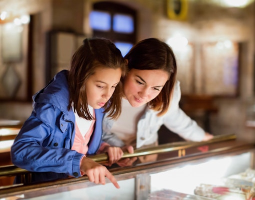 Mother and daughter examining exhibit at Sciencework museum.