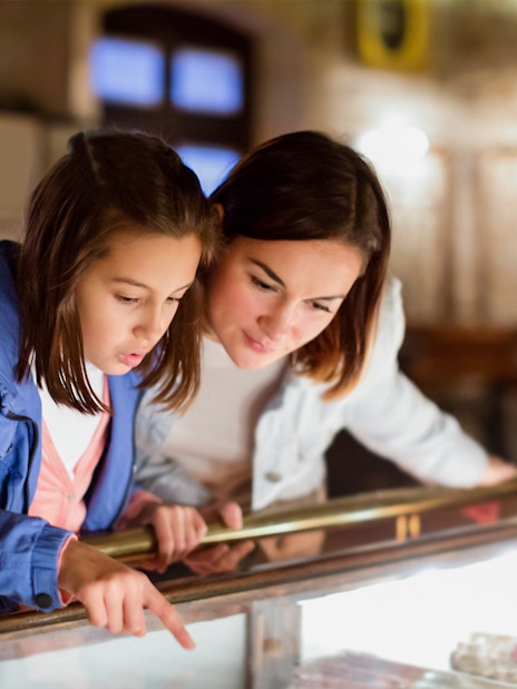 Mother and daughter examining exhibit at Sciencework museum.
