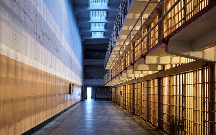 Alcatraz Island cell block corridor during evening tour.