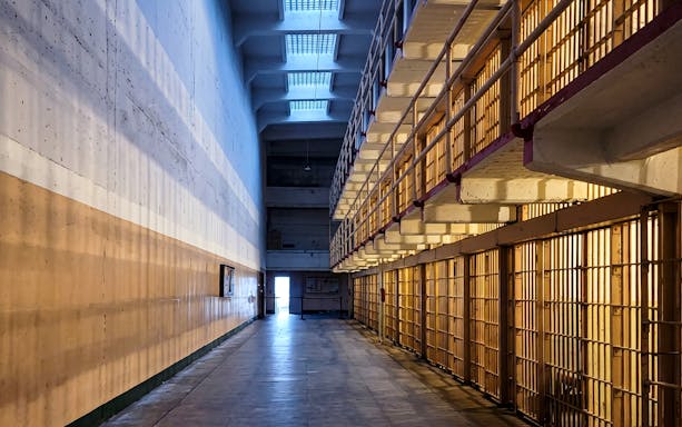 Alcatraz Island cell block corridor during evening tour.