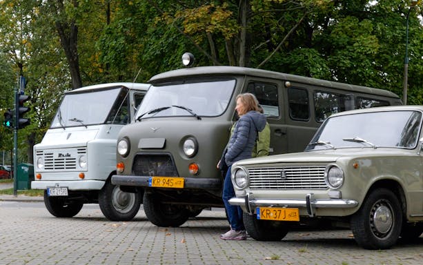 Vintage vehicles parked near Nowa Huta Steel Mill Administration Buildings, Krakow.