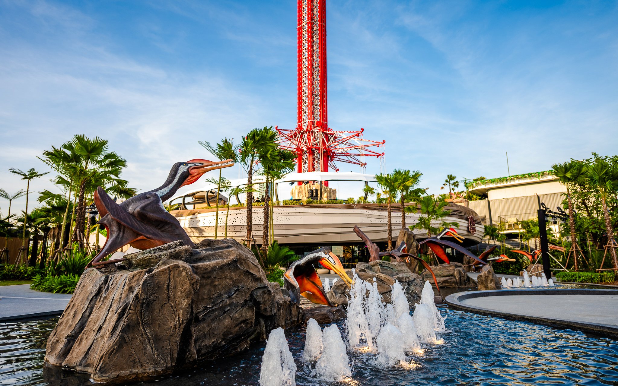 SkyFlyer installation with animal sculptures and fountains at Asiatique Bangkok.