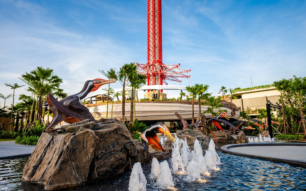 SkyFlyer installation with animal sculptures and fountains at Asiatique Bangkok.