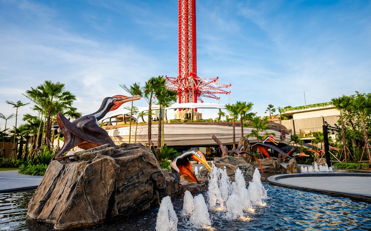 SkyFlyer installation with animal sculptures and fountains at Asiatique Bangkok.