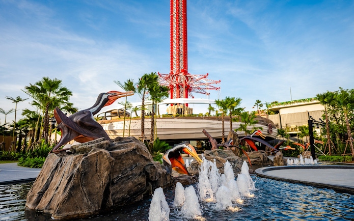 SkyFlyer installation with animal sculptures and fountains at Asiatique Bangkok.