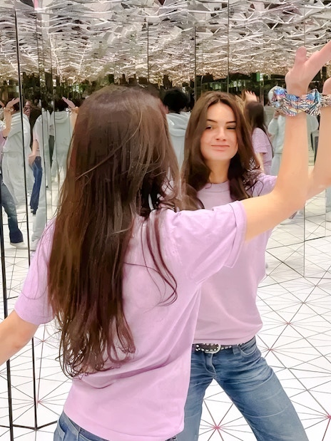 Visitors interacting in the infinity mirror room at Paradox Museum Paris.