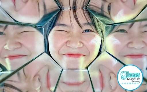 Winking face reflected in mirrors at Glass Museum Penang.