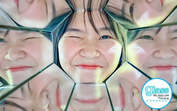 Winking face reflected in mirrors at Glass Museum Penang.