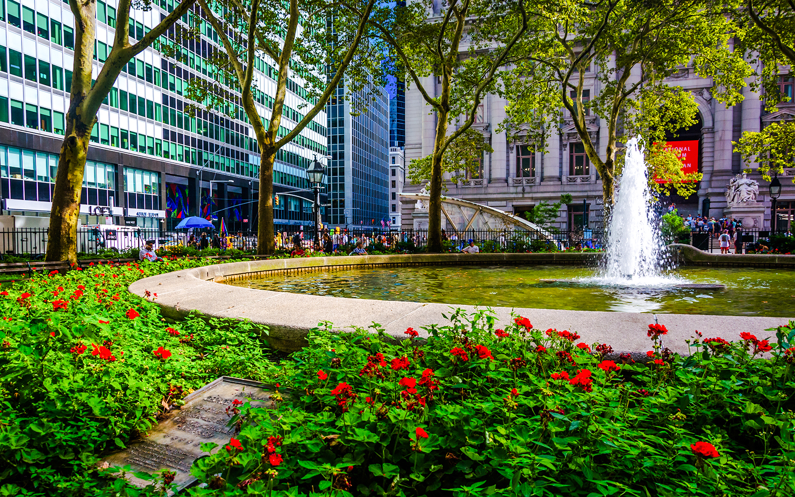 Fountain and flowers in Bowling Green Park, New York City.