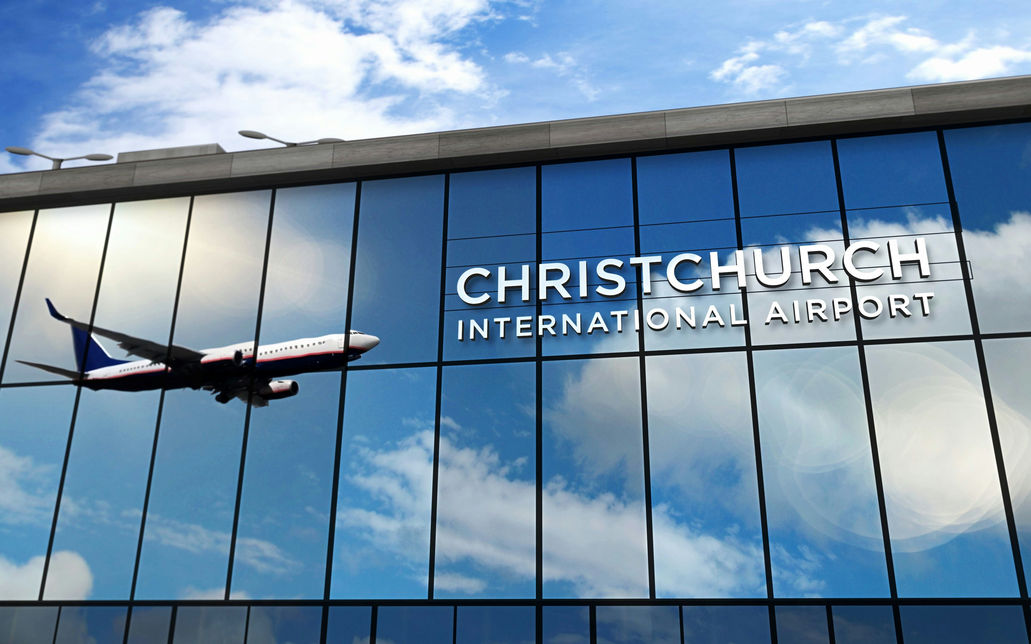 Airplane reflected in Christchurch International Airport terminal windows, New Zealand.