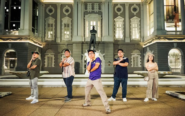 Group posing in front of the Asian Civilisations Museum during Singapore Street Food & Night Tour.