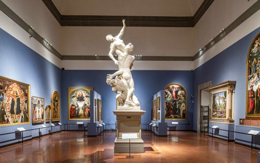 Accademia Gallery interior with Renaissance sculptures and paintings, Florence tour.