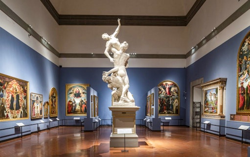 Accademia Gallery interior with Renaissance sculptures and paintings, Florence tour.