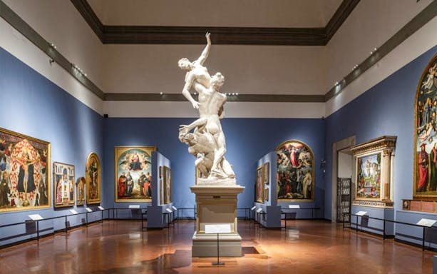 Accademia Gallery interior with Renaissance sculptures and paintings, Florence tour.