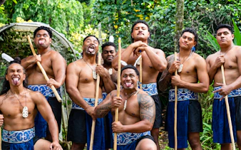 Polynesian men performing traditional haka at Toa Luau, Hawaii.