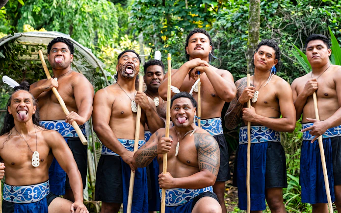 Polynesian men performing traditional haka at Toa Luau, Hawaii.