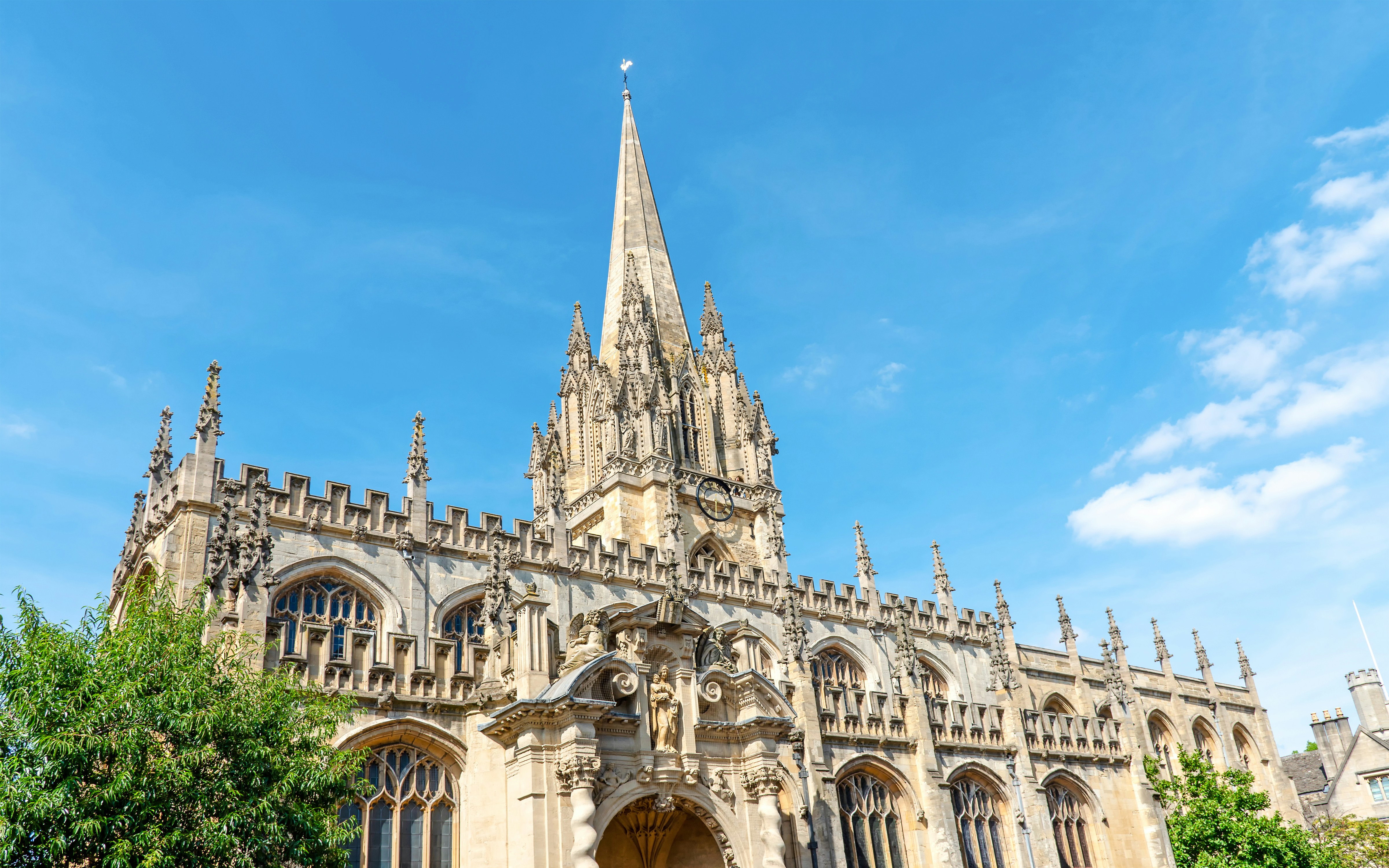 St Mary the Virgin church with spire and ornate facade, Oxford, England.