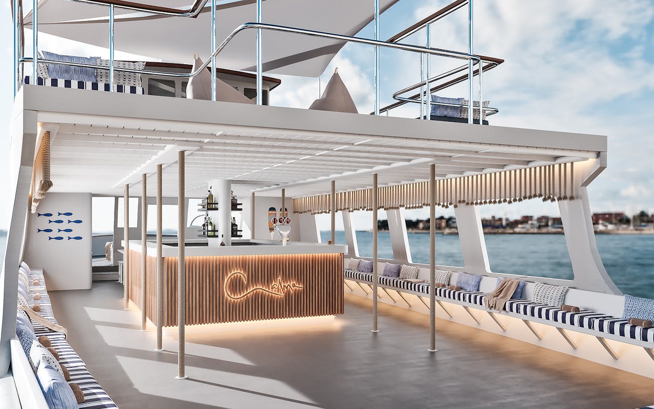Luxurious boat interior with bar and seating on Palma Bay tour.