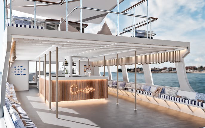 Luxurious boat interior with bar and seating on Palma Bay tour.