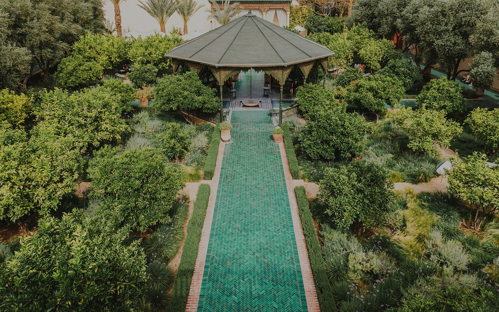 Jardin Secret garden with pavilion and green pathway in Marrakech, Morocco.