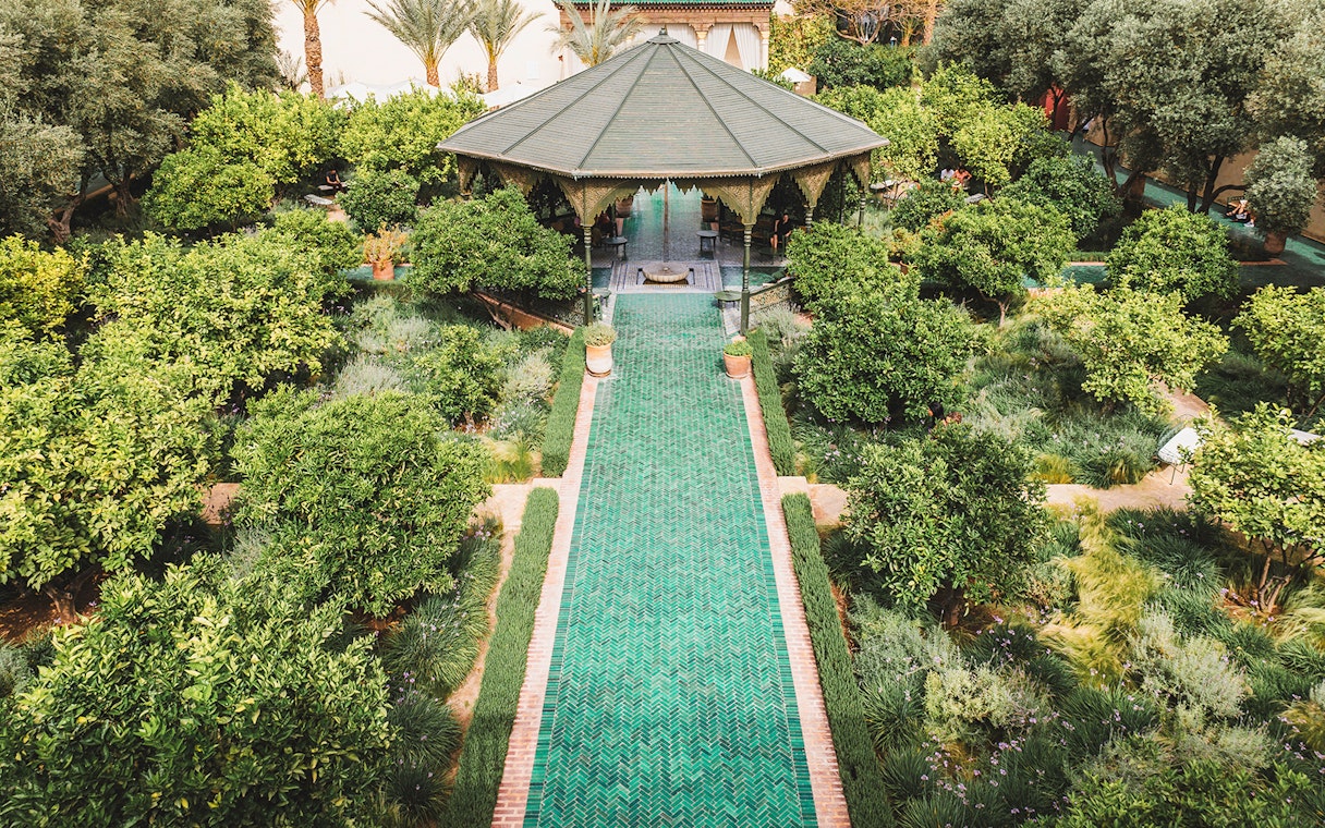 Jardin Secret garden with pavilion and green pathway in Marrakech, Morocco.