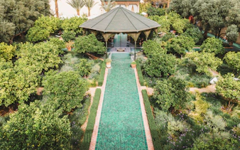 Jardin Secret garden with pavilion and green pathway in Marrakech, Morocco.