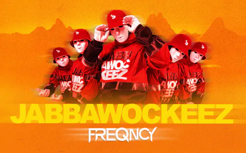Jabbawockeez dancers in red outfits and masks promoting Vegas show.