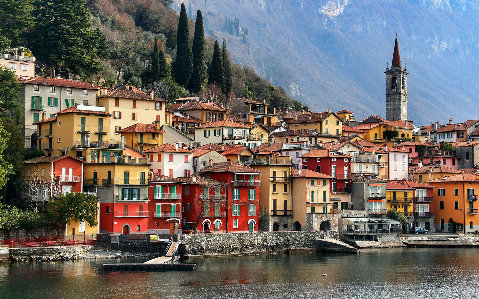 Colorful houses and a church tower in Varenna, Lake Como, Italy.