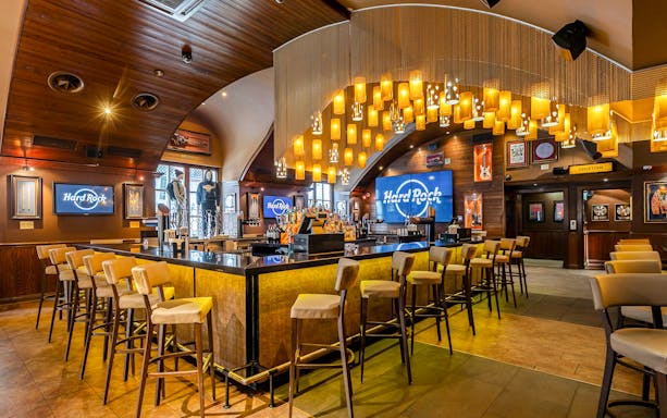 Interiors of Hard Rock Cafe München featuring bar area and iconic decor.