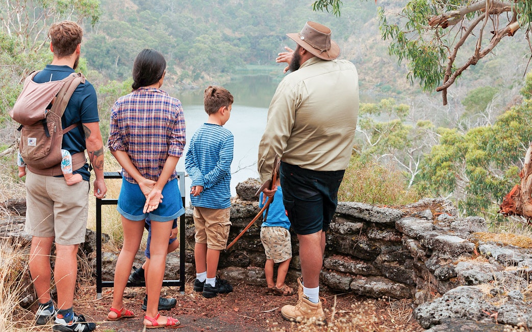 Tour guide explaining landscape to visitors on Tungatt Mirring Stone Country Half Day Tour.