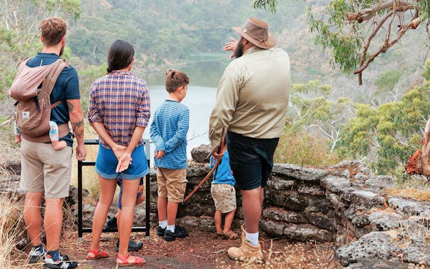 Tour guide explaining landscape to visitors on Tungatt Mirring Stone Country Half Day Tour.
