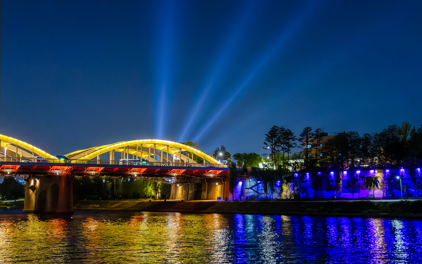 Night view of illuminated bridge over Han River, Seoul, seen from Starlight Cruise, Eland Cruise.