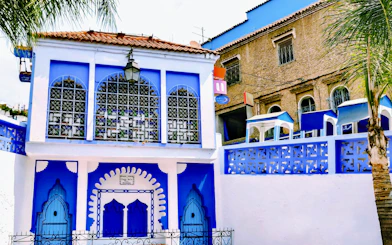 Blue and white building facade in Chefchaouen, Morocco.