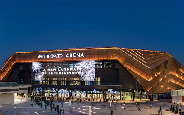 Etihad Arena exterior at night, venue for Symphony of Stars with Atif Aslam.