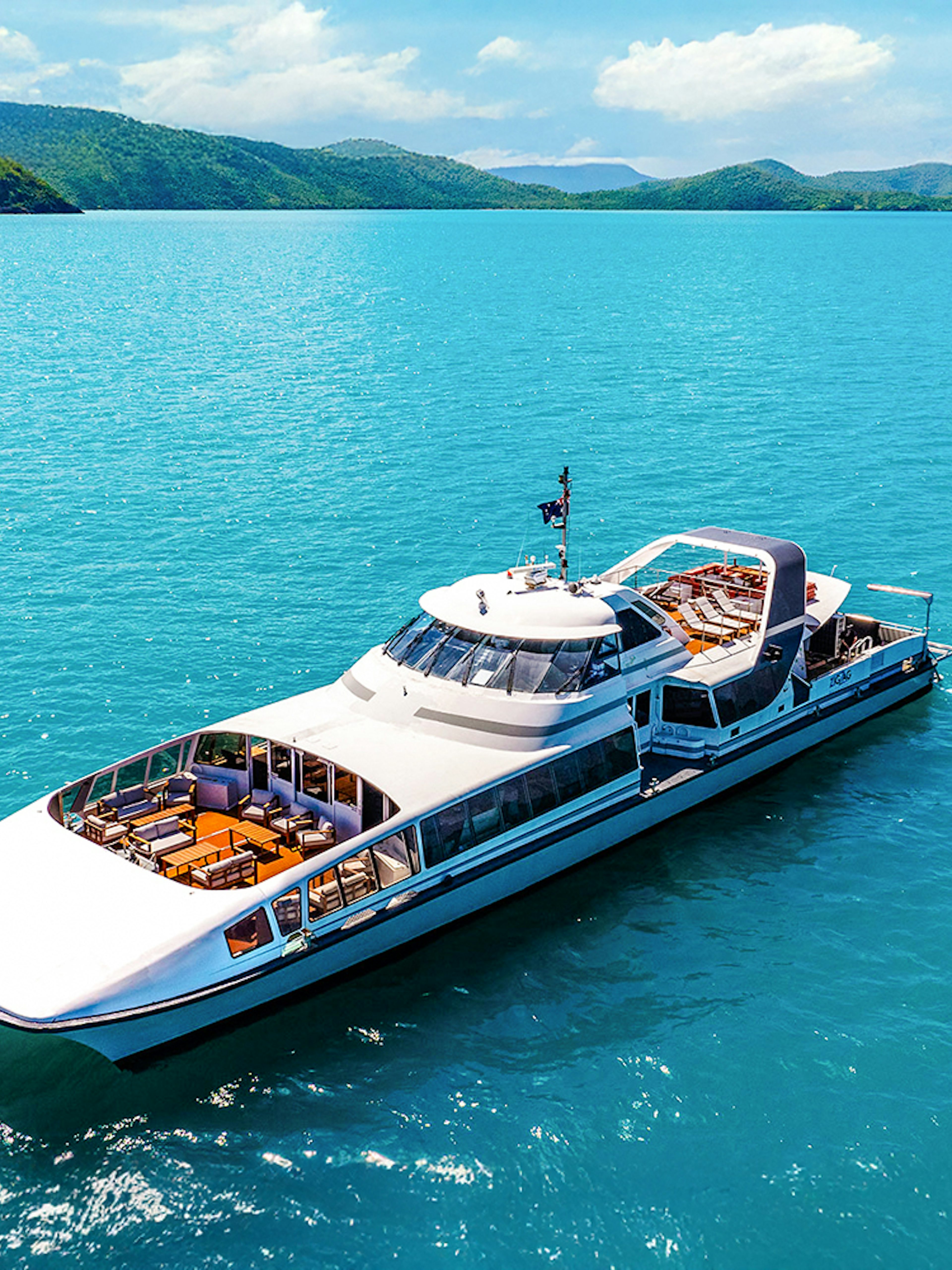 Catamaran cruising in Whitsundays on ZigZag Day Tour, Australia.