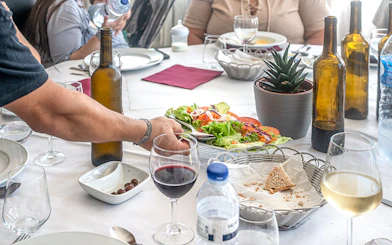 Lunch table with wine, salad, and bread during Douro Historical Tour from Porto.