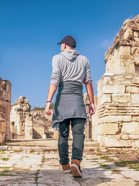 Guest walking through ancient ruins of Hierapolis, Turkey.
